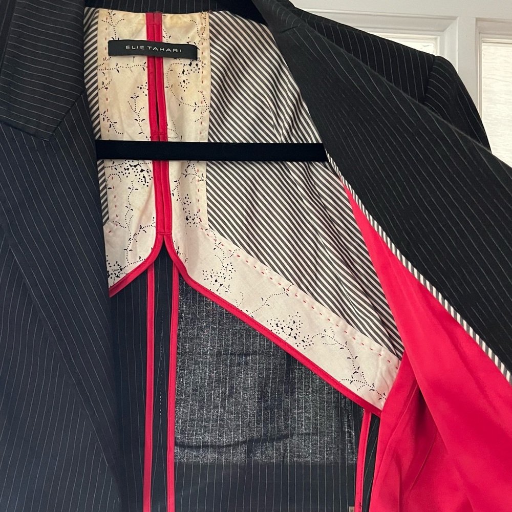 Black pinstripe blazer with accent cuffs & a silk patterned interior